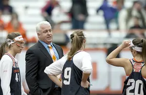Syracuse head coach Gary Gait (second from left) discussed the need for a possession clock in women's lacrosse several times throughout this past season. On Thursday, the NCAA announced a possession clock will be added in 2017.