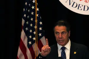 It's unclear how exactly New York state's new $15 minimum wage, which was pushed forward by Gov. Andrew Cuomo (right), will affect Syracuse University.