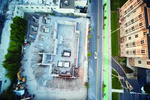 A drone captures a bird's eye view image of where luxury apartment complex #BLVD404 will be built.