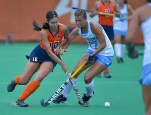 Forward Emma Lamison converges on the ball with a North Carolina player. Lamison had the assist on Emma Russell's late, go-ahead goal.
