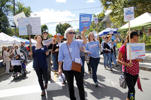 Ralliers march in support of democratic presidential hopeful Bernie Sanders at the Westcott Street Cultural Fair. The rally was volunteer-led and not organized by anyone in Sanders' official campaign. 