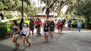 Students at Florida State University participate in a class simulation where they perform tasks and travel via the guidance of another student while wearing a blindfold. The course is called 