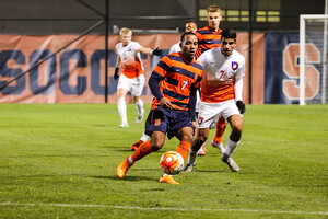 Ben Polk plays a ball with his back to the net. Syracuse's leading goal-scorer recorded three shots on goal in the 1-0 loss.