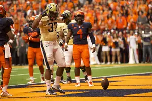 Zaire Franklin (4) looks on as Pittsburgh running back Qadree Ollison celebrates a touchdown in No. 25 Pitt's 23-20 win over Syracuse on Saturday.