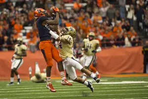 Steve Ishmael climbs Pitt cornerback Avonte Maddox for an eventual 40-yard grab during Syracuse's 23-20 loss to Pittsburgh on Saturday in the Carrier Dome.