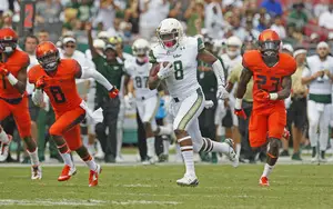 USF's Tyre McCants (8) breaks free for a long run at the end of the first quarter during USF's game against Syracuse. The Bulls topped the Orange, 45-24. 