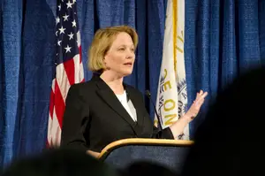 Joanie Mahoney, shown here delivering the State of the County in March 2014, is running for a third term as Onondaga County Executive.