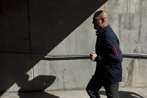 Scott Shafer jogs through the tunnel before Saturday's game at N.C. State. It was the last game Syracuse had to salvage any bowl hopes, but a 42-29 loss put those to rest.