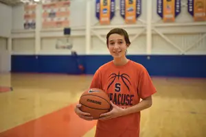 Sophomore Lenn Brown grew up dreaming of attending Syracuse University when he went to Orange basketball games. Now, after overcoming cancer, he's a manager of the team.