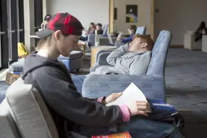 A student takes a snooze in Panasci Lounge.