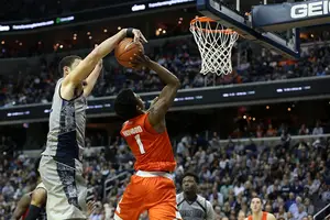 Frank Howard has his shot blocked against the Hoyas on Saturday. The Georgetown bigs dominated down low in a seven-point win.
