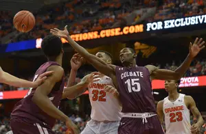Dajuan Coleman scraps for the ball on Tuesday night. Both the Orange and the Raiders secured 32 rebounds in SU's 27-point win.
