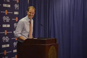 Mike Hopkins smiles after Syracuse's 78-51 win on Tuesday night. He showed that he's willing to go to a six-man rotation, if need be.