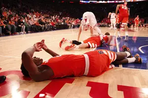 Tyler Roberson lay on the court in Syracuse's loss to St. John's on Sunday. The Orange was upset because of several missed opportunities.