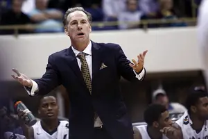 Pittsburgh head coach Jamie Dixon reacts to a moment in his team's conference-opening win against Syracuse on Wednesday night.