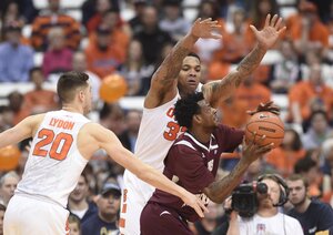 Dajuan Coleman defends against Texas Southern's Chris Thomas on Sunday in the Carrier Dome. Coleman chipped in 14 points in Syracuse's 13-point win.