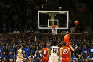 Tyler Roberson throws down an alley-oop against the Blue Devils on Monday night at Cameron Indoor Stadium. He finished with 20 rebounds on the night in the Orange's marquee win of the season.