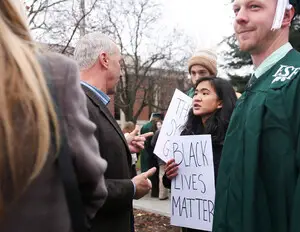 An SU student confronts a parent of a SUNY-ESF graduate outside of Hendricks Chapel during a December 2014 protest regarding Darren Wilson, the police officer who shot and killed Michael Brown, not getting indicted. 