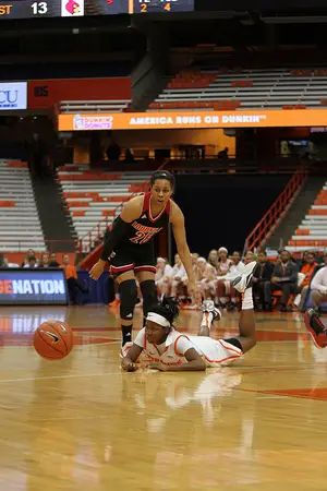 Alexis Peterson lies flat on the court as the ball bounces in front of her. Syracuse couldn't come back from a 21-point first-half deficit.