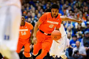 Michael Gbinije, who started his college career at Duke, dribbles down court during the teams' meeting at Cameron Indoor Stadium last year. 