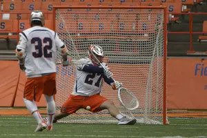 Warren Hill dives to make a save on Saturday against Siena. He allowed just two goals in three quarters of play in his first career start.