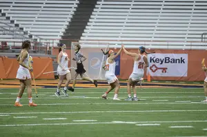 Riley Donahue (No. 47), Halle Majorana (No. 37) and Kayla Treanor (No. 21) combined to score seven of the Orange's 16 goals and assisted on six more.