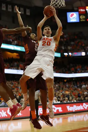 Tyler Lydon holds the ball with two hands under the basket. He finished with 13 points in 29 minutes on Tuesday against the Hokies.