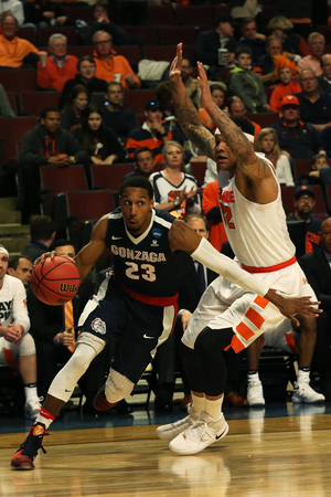 Dajuan Coleman and Syracuse will put its trademark 2-3 zone defense on the line against Virginia's trademark Pack Line man-to-man defense. 