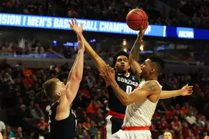Michael Gbinije and Syracuse will face top-seeded Virginia will square off tomorrow at the United Center in Chicago. 