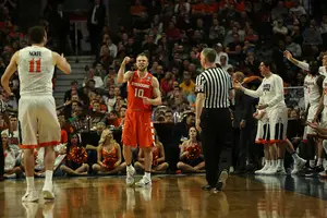Trevor Cooney and the Orange will take on North Carolina in the Final Four on Saturday night. Here's how our beat writers predict the game will unfold.