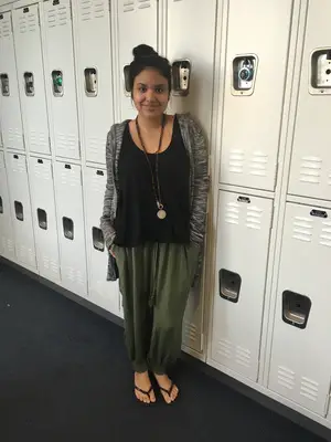 Kennedy Patlan styled dark green drawstring pants with a marled cardigan and a Guatemalan-made necklace.