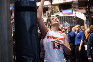 Brianna Butler walks off the court after Syracuse beat Washington in the Final Four to advance to the national championship game.