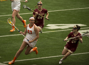 Kelly Cross scored two goals in the delayed portion of the game on Tuesday to lead Syracuse. 