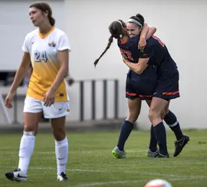 Stephanie Skilton (right) carried Syracuse to a 2-1 win over Cornell with two goals on Sunday.
