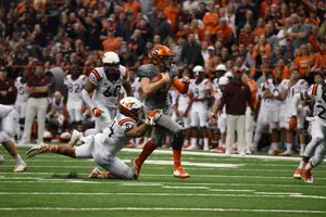 Eric Dungey took a beating and had to leave the field for an injury, but he came back and lead Syracuse to its 31-17 win. 