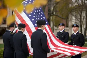 Members of the ROTC program at Syracuse University hold the American flag during the Veteran's Day Ceremony in 2012.

