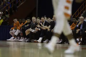 Tyler Lydon sits with an icepack on his right leg and in warmups as the second half begins. 