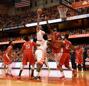 Dajuan Coleman rises up for a jump hook in Syracuse's victory over Cornell last December. 