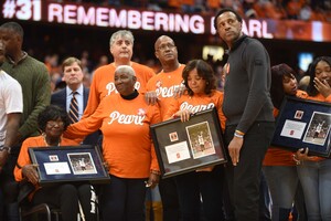 Pearl Washington's family and former teammates received commemorative frames that included a photo of Washington and a piece of the old court. 