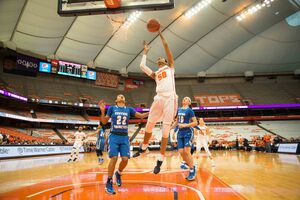 Briana Day soars in the air on Sunday in the Carrier Dome. She scored 22 points in 18 minutes.