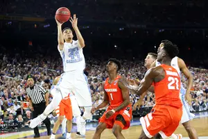 The Orange lost, 83-66, to the Tar Heels in the Final Four in Houston on April 2, 2016. UNC scored 50 points in the paint, including this Justin Jackson floater. 