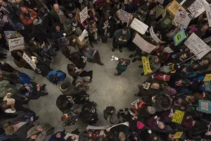 Hundreds of protestors gathered at Terminal A at Syracuse's Hancock International Airport on Sunday night to protest President Donald Trump's recent executive order banning immigration from seven majority Muslim countries. 