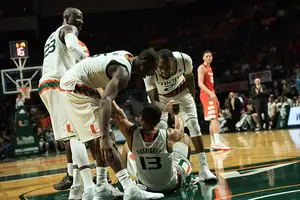 Tyler Lydon watches Miami players celebrate during the Hurricanes' victory over Syracuse last season.