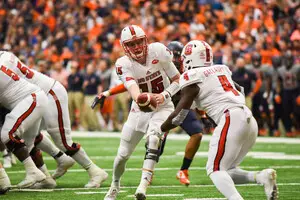 In 2016 playing at the Carrier Dome, NC State's efficient signal-caller Ryan Finley hands off to Reggie Gallaspy II, who has assumed a larger role with the Wolfpack's rushing attack this season.