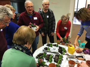 Members of Syracuse Memory Cafe (above) attend a monthly meeting where they participate in activities.
