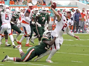Miami sacked Eric Dungey three times and he threw four interceptions, all in the first half, in the loss. 