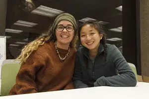 Audrey Miller (left), secretary of Thrive at SU, and Amanda Chou (right), president of Thrive at SU, celebrate the student-run organization's first-year anniversary on campus.