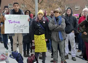 Students, faculty, staff and community members gathered to protest a GOP tax bill.