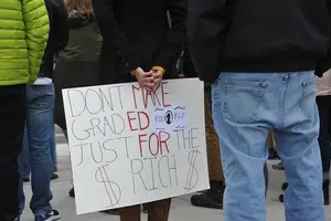 Graduate students rallied against the GOP tax bill Wednesday, and SU administrators lobbied to voice those same concerns.