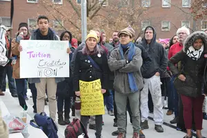 A crowd grad students rallied near Hendricks Chapel to voice their concerns about the new GOP Tax Bill.